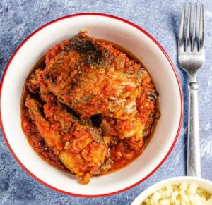 fish with red stew in a bowl